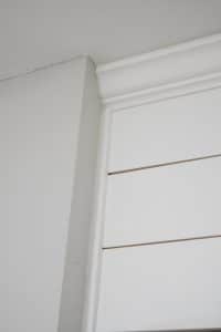 trim pieces on shiplap wall