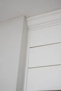 trim pieces on shiplap wall