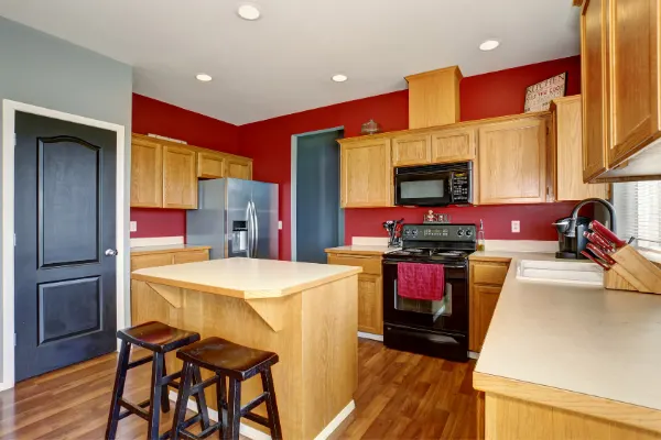 red kitchen walls wood cabinets