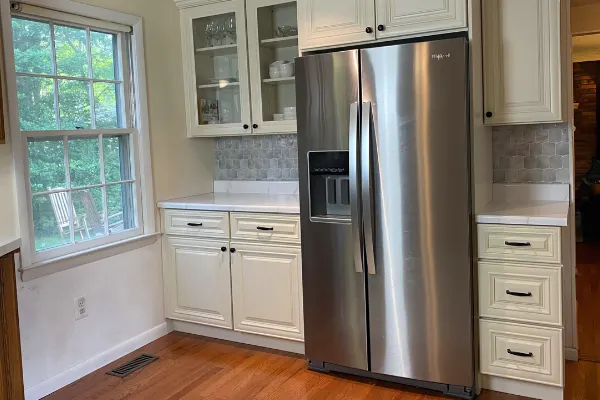 Cool white countertops with warm white cabinets