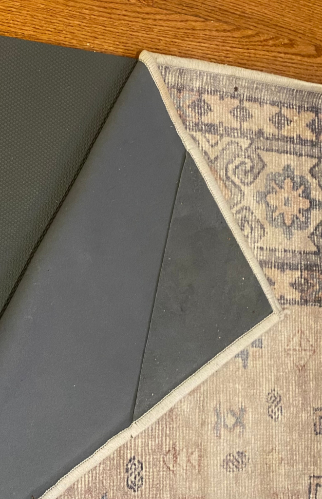 Tumble rug's corner piece keeps the rug on the pad.