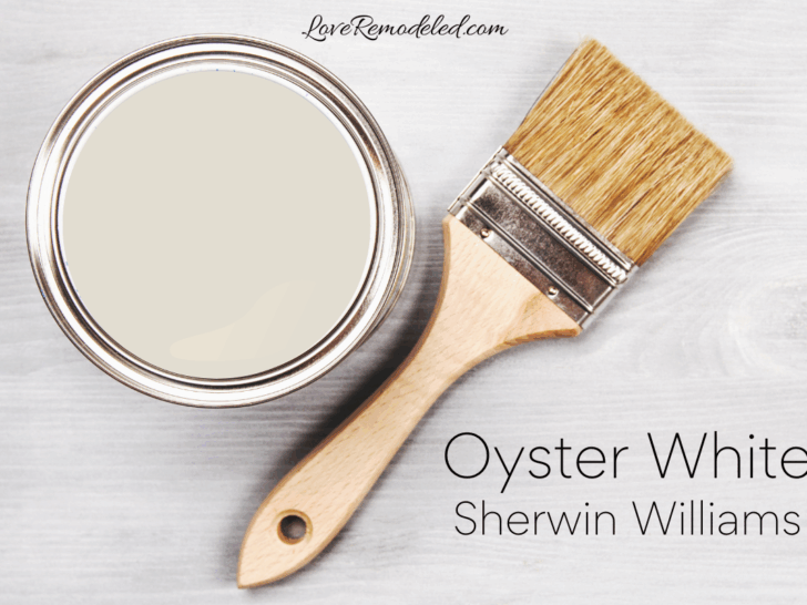 Oyster White by Sherwin Williams - Oyster White in a paint can with a paint brush beside it